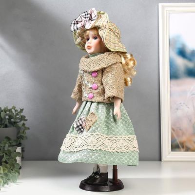 Кукла коллекционная керамика "Блондинка с кудрями, в зелёном свитере с тесьмой" 40 см
