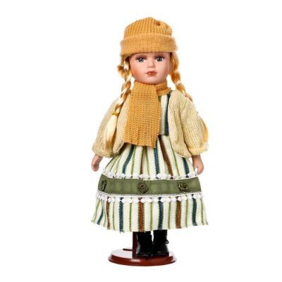Кукла коллекционная керамика "Блондинка с косами платье зелён.полоска и белый кардиган" 30см   54832