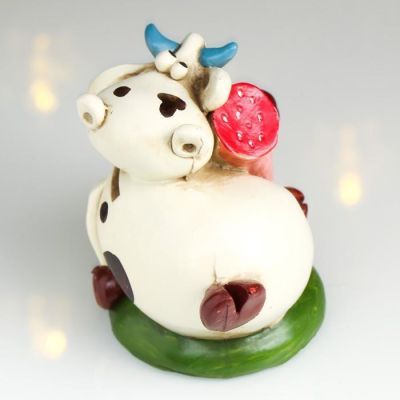 Копилка полистоун "Бычок Гаврюша с колбасой" 9,5х12х7,5 см