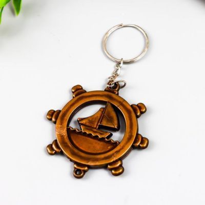 Брелок пластик под металл "Корабль в штурвале" 3,8х3,8 см