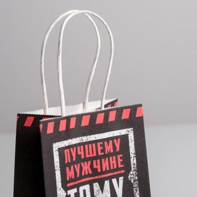 Пакет подарочный крафт «Тому кто держит удар», 12 × 21 × 9 см