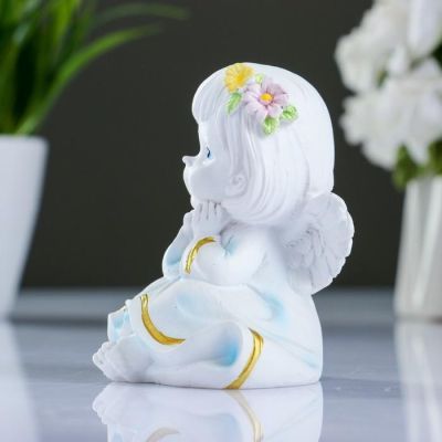 Фигура "Ангел с двумя цветочками в волосах" 7х8х9см