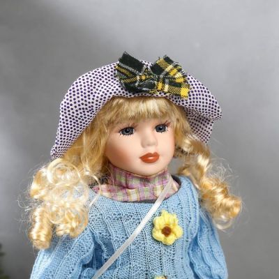Кукла коллекционная керамика "Блондинка с кудрями, в голубом свитере с цветочками" 40 см