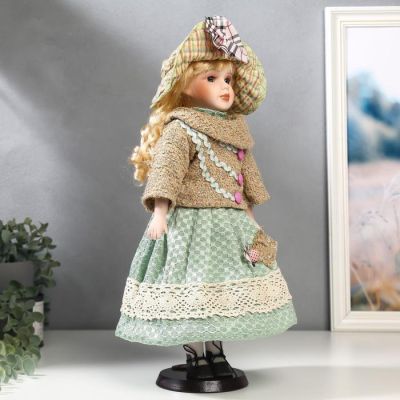 Кукла коллекционная керамика "Блондинка с кудрями, в зелёном свитере с тесьмой" 40 см