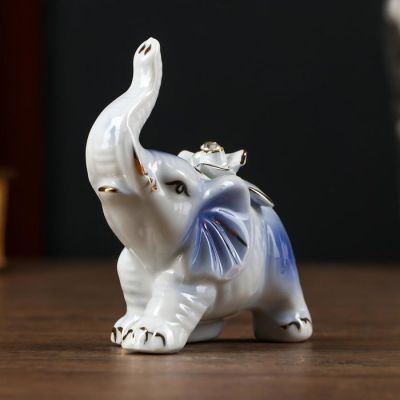 Сувенир керамика "Слонёнок с розой на спине" синий с золотом, страза 9х9х3,8 см